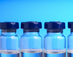 Vials of liquid on a blue background